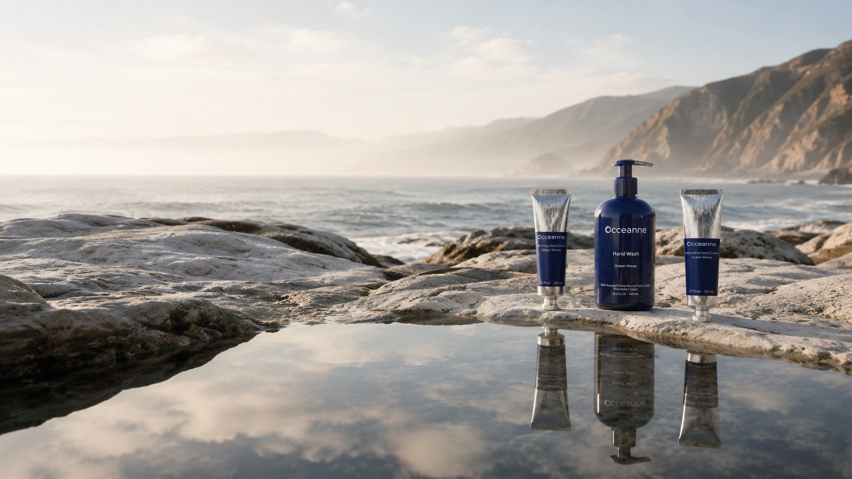 Ocean Waves hand care collection arranged beside the Pacific coastline
