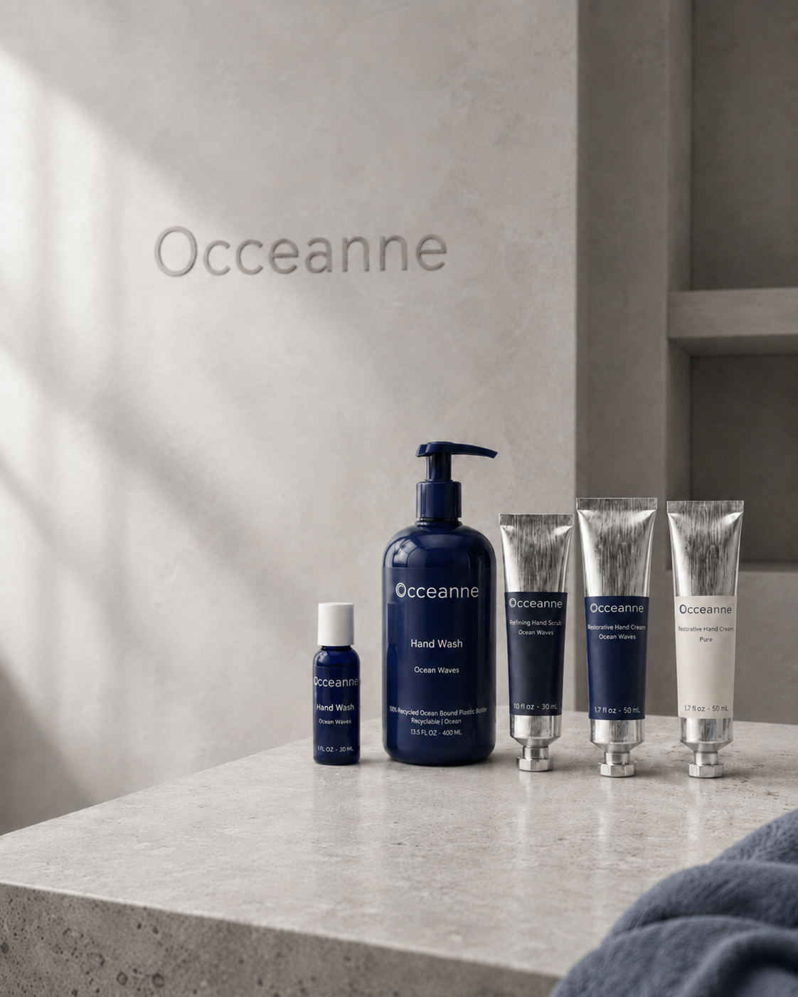 Occeanne hand care collection arranged with an olive branch